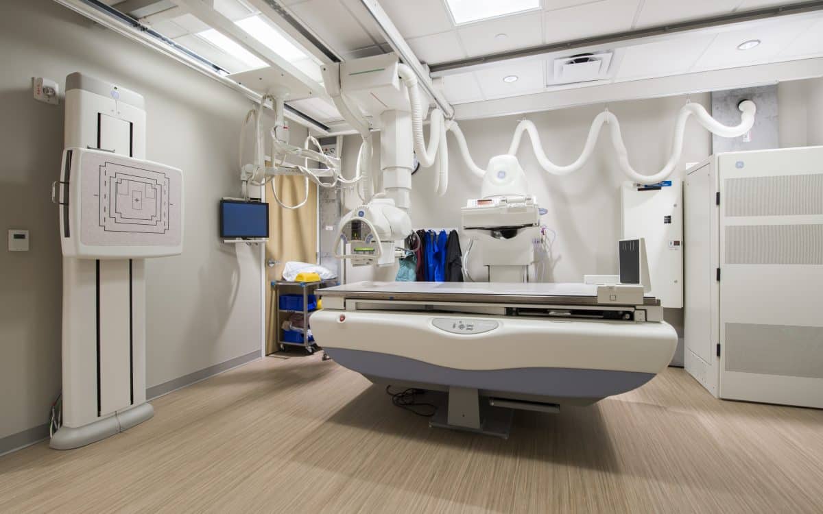 An image of a hospital room with a x-ray machine.
