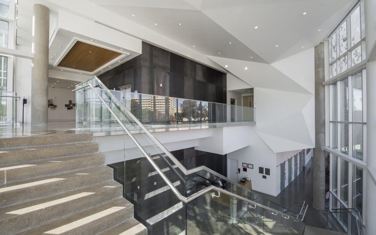 A glass staircase in a modern office building.