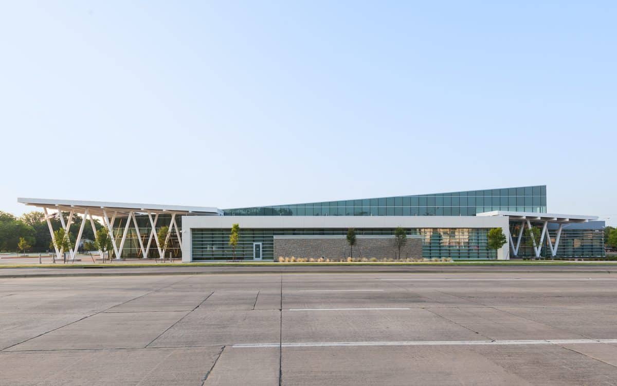 An airport building with a large glass roof.