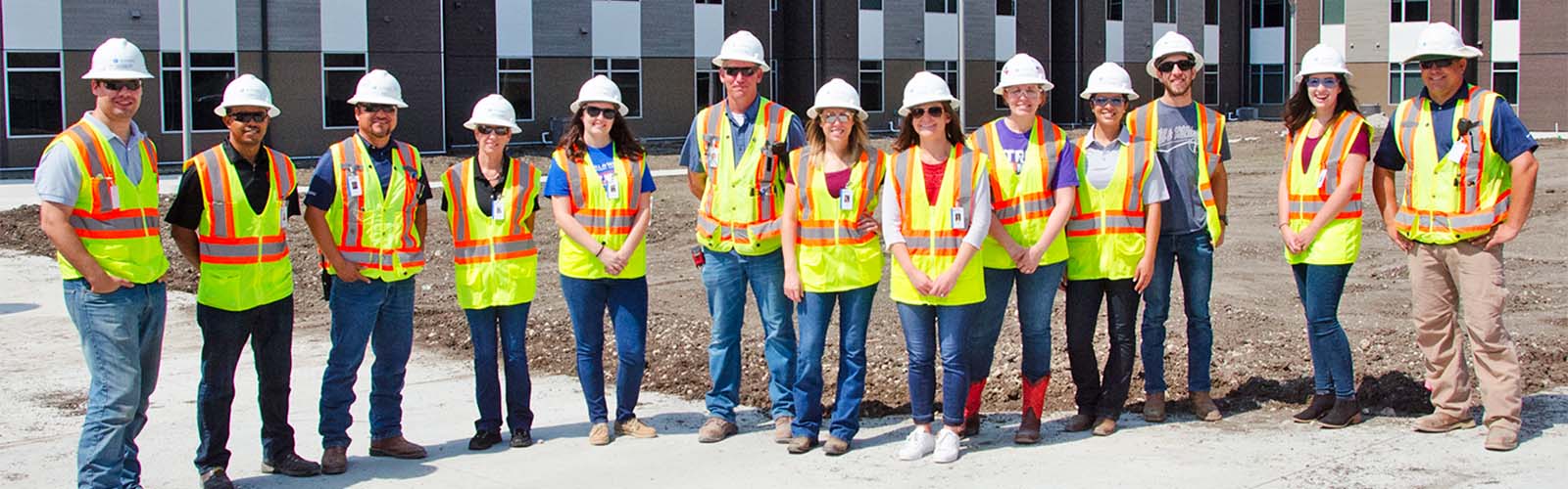A group of construction workers posing for a photo.