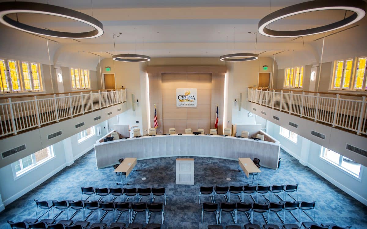 An aerial view of a courtroom with chairs and windows, showcasing the municipal construction.