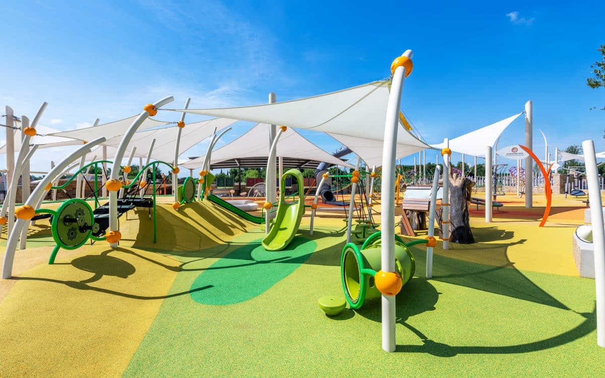 A playground with a lot of green equipment was constructed.
