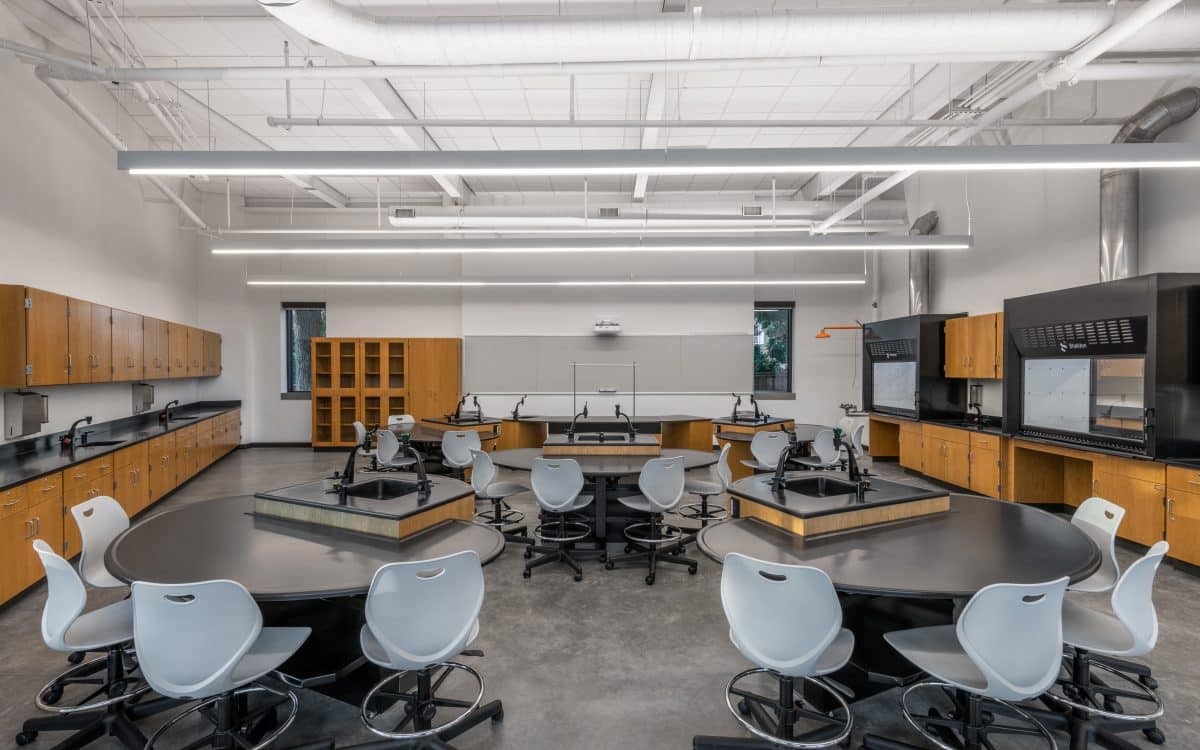 A science lab with tables and chairs.