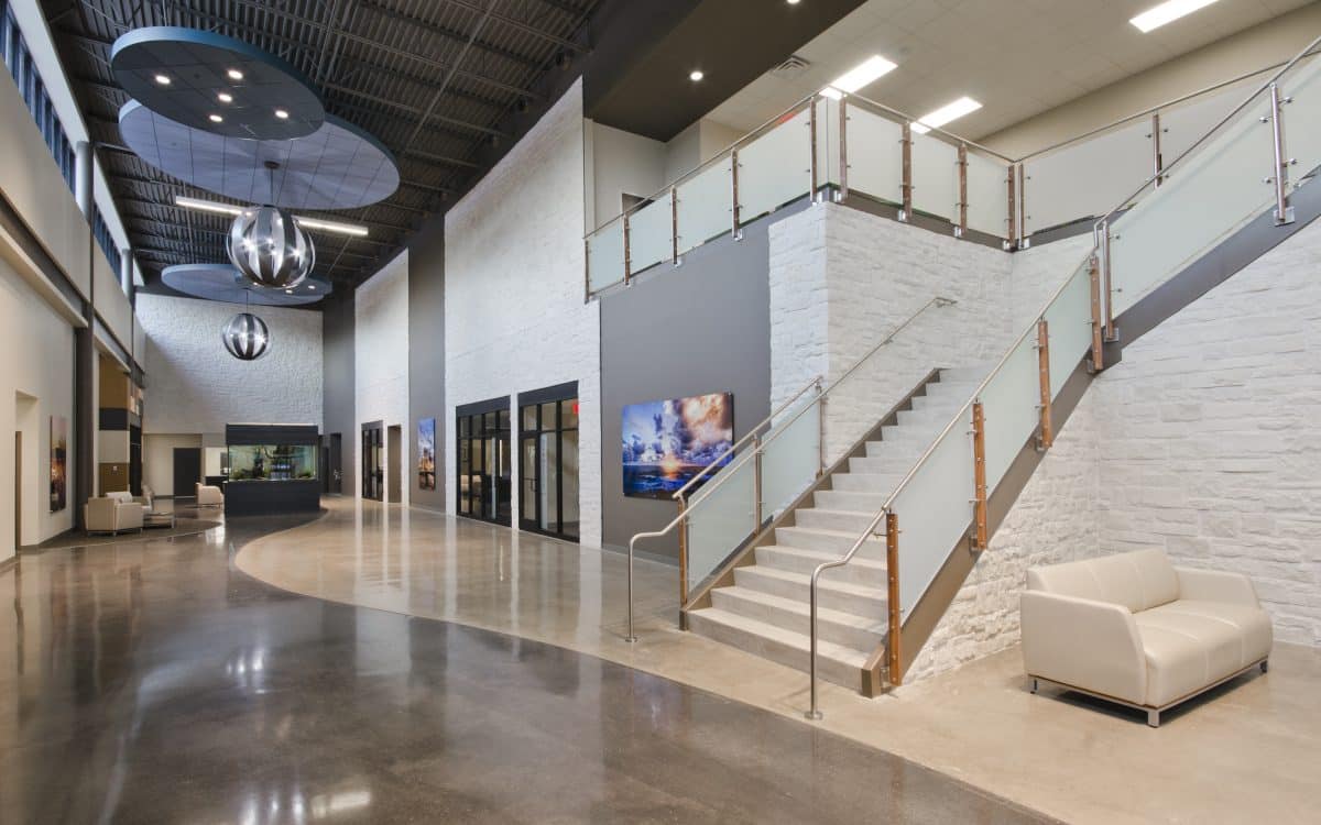 The lobby of a modern office building with a staircase.