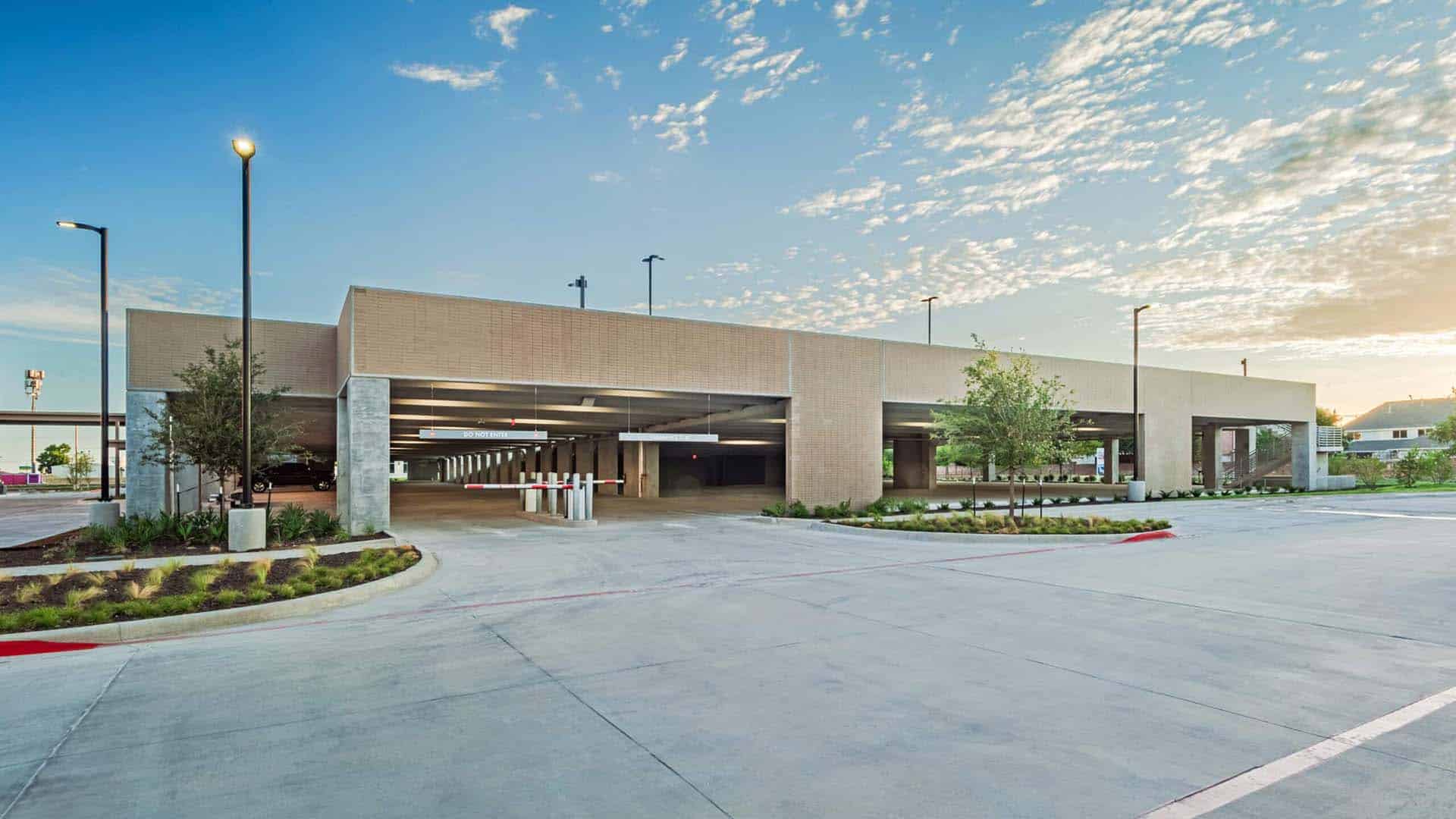 A parking garage with a lot of cars.